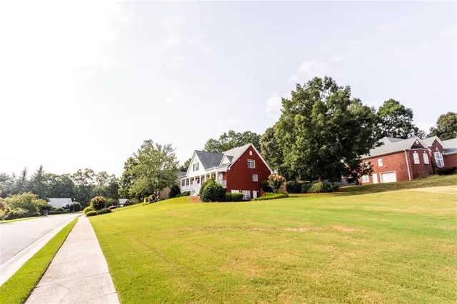 a sign board with yard in front of it