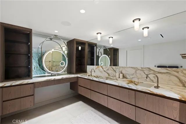 a bathroom with a double vanity sink and a mirror