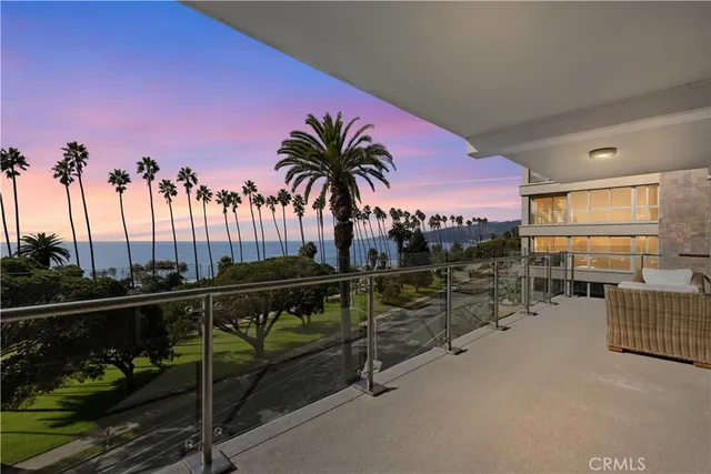 a view of a patio with a table and chairs