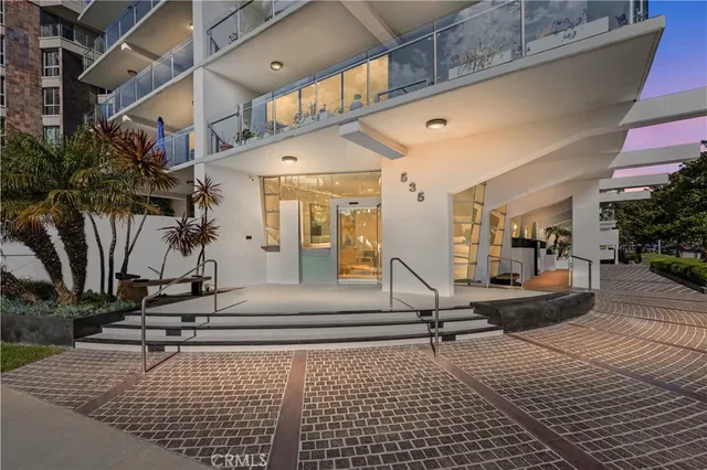 a view of a building with sitting area