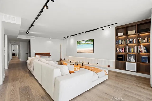 a bed room with a bed and a book shelf