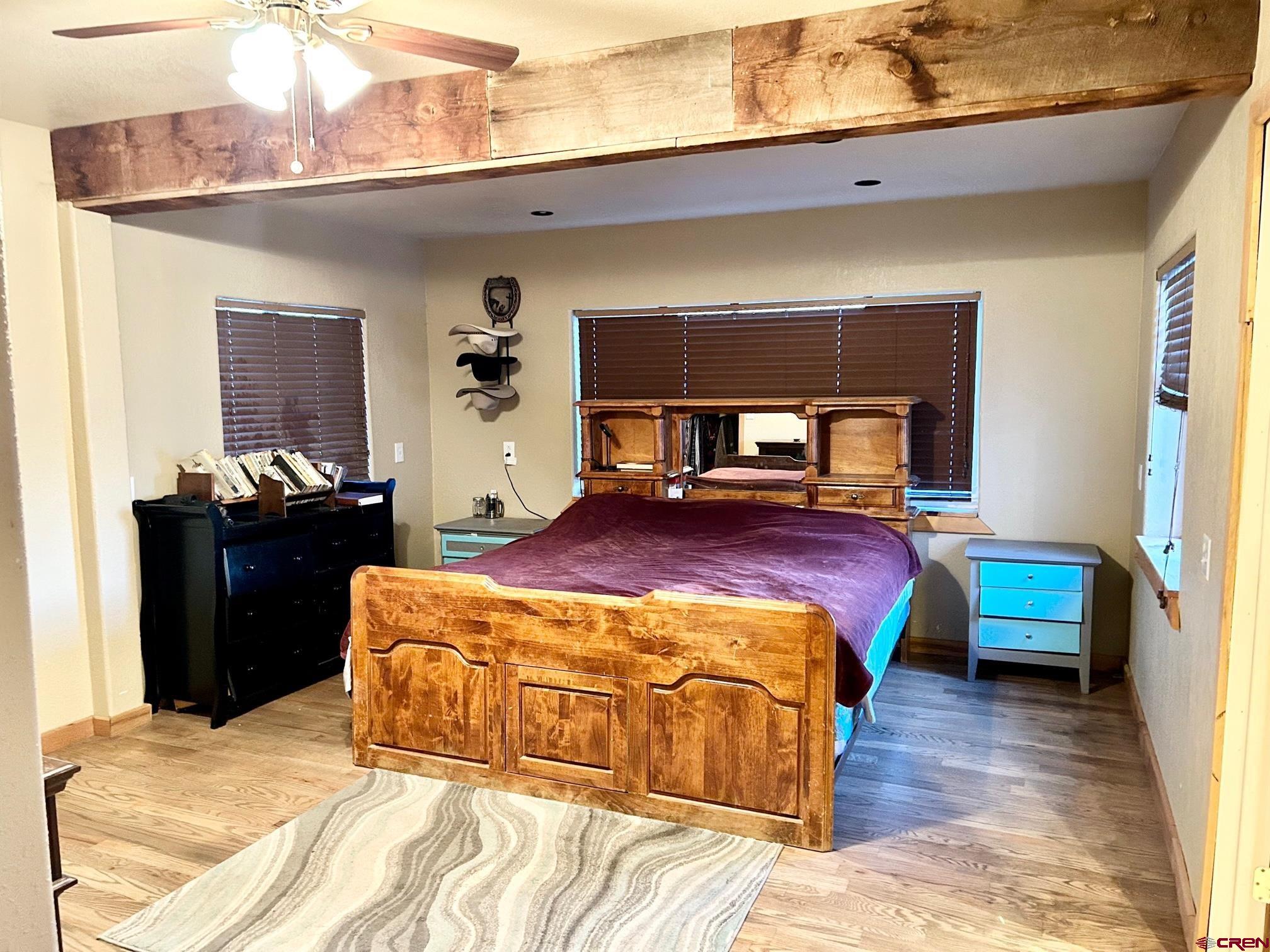 175 County Road Egnar, CO 81325 - Photo 16 of 35 a bedroom with a bed and wooden floor