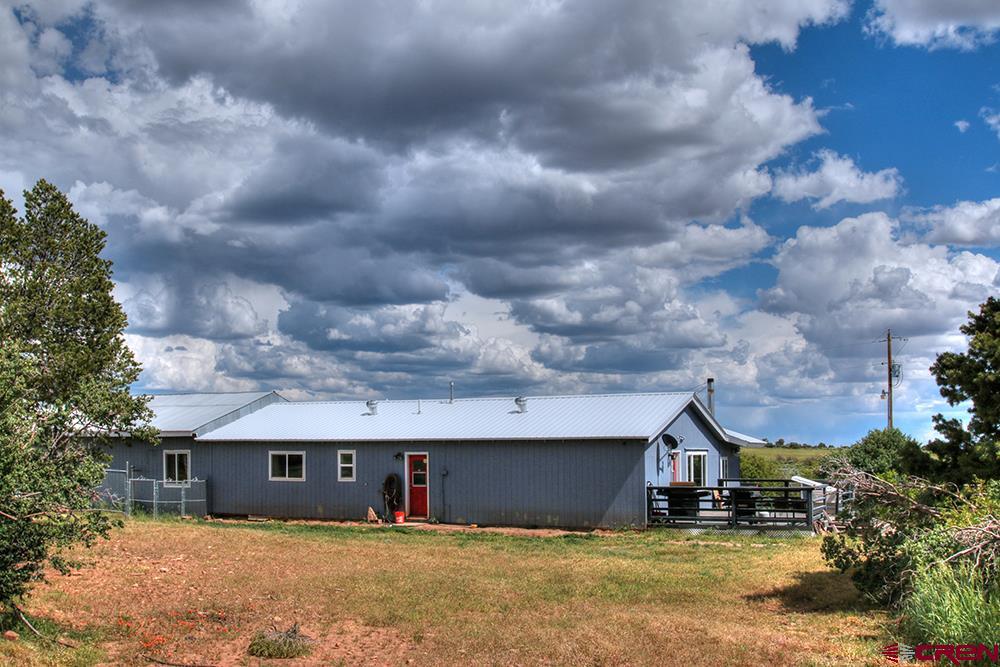 175 County Road Egnar, CO 81325 - Photo 31 of 35 an aerial view of residential houses with yard and entertaining space