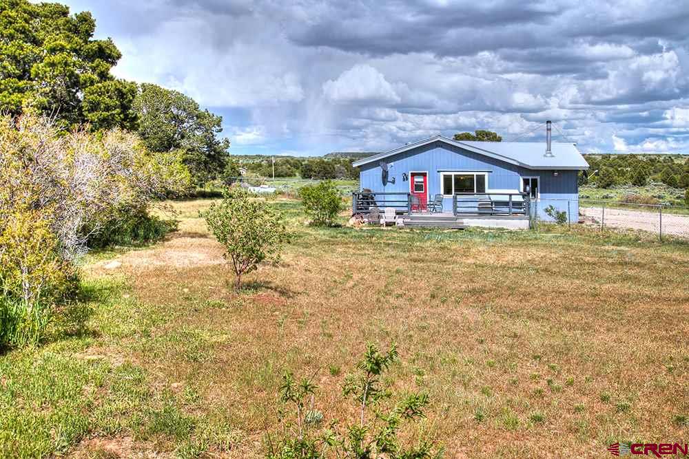 175 County Road Egnar, CO 81325 - Photo 32 of 35 a view of a house with a yard