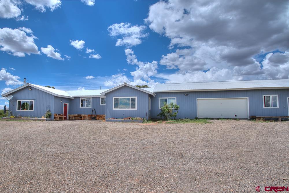 175 County Road Egnar, CO 81325 - Photo 33 of 35 a big house with palm trees in front of it