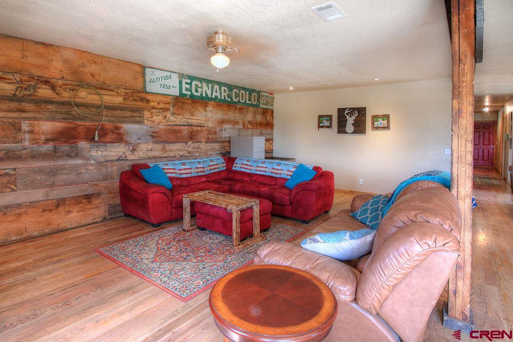 175 County Road Egnar, CO 81325 - Photo 7 of 35 a bedroom with double bed and a window
