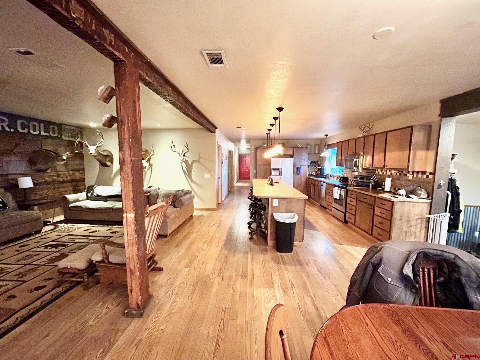 175 County Road Egnar, CO 81325 - Photo 8 of 35 a living room with lots of furniture and kitchen view