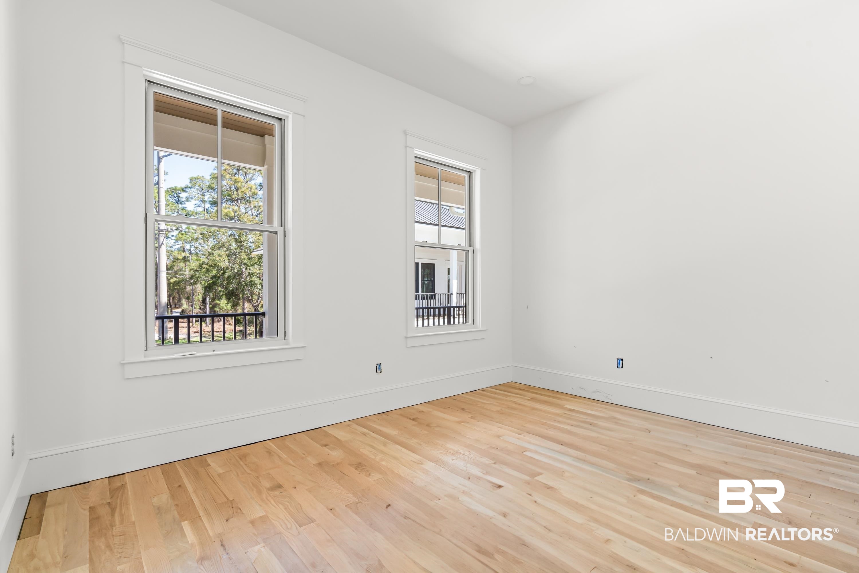 14686 State Highway Gulf Shores, AL 36542 - Photo 10 of 44 Unfurnished room with baseboards and wood finished floors