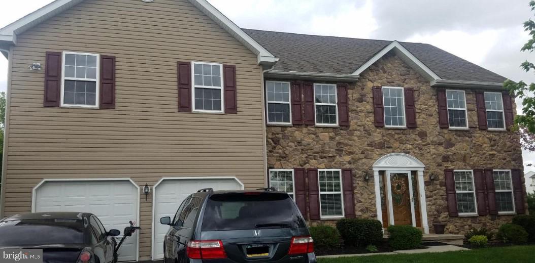 1074 Grayson Drive Souderton, PA 18964 - Photo 2 of 6 a front view of residential houses with yard
