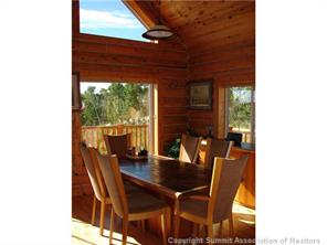 3260 High Creek Road Fairplay, CO 80440 - Photo 4 of 12 a view of a dining room with furniture and window