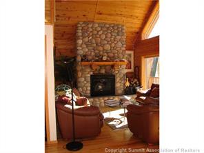 3260 High Creek Road Fairplay, CO 80440 - Photo 5 of 12 a living room with furniture and a fireplace