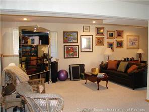 3260 High Creek Road Fairplay, CO 80440 - Photo 10 of 12 a living room with furniture a rug and a chandelier