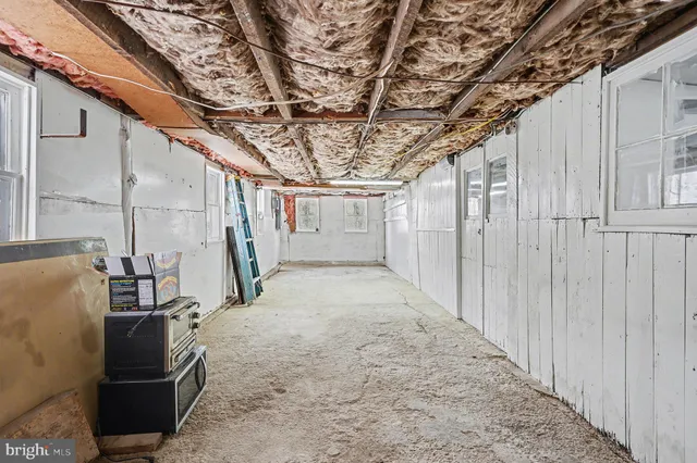 a view of a room with wooden walls