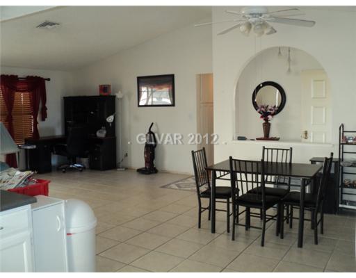 Den. LIVING AND EATING AREA, CERAMIC TILE FLOORING, VAULTED CEILINGS