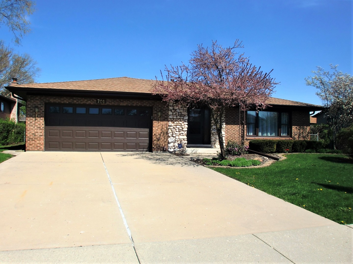 701 Ridge Court Schaumburg, IL 60193 - Photo 1 of 24 a front view of a house with a yard