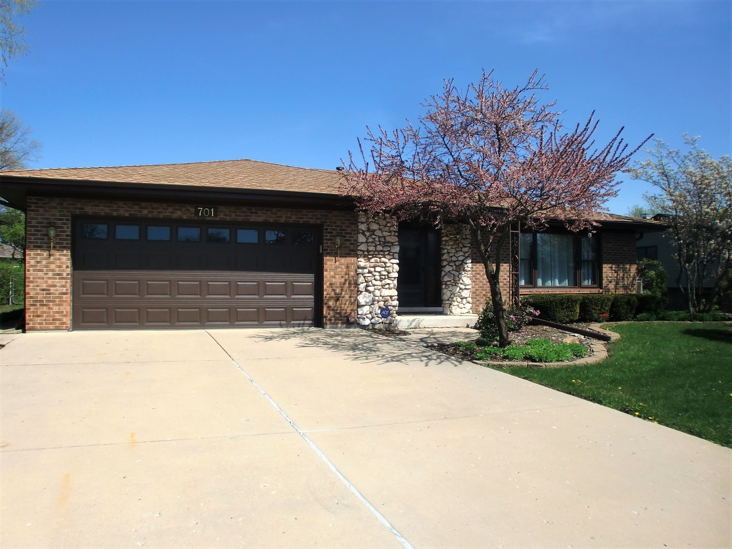 701 Ridge Court Schaumburg, IL 60193 - Photo 2 of 24 a front view of a house with a yard and garage