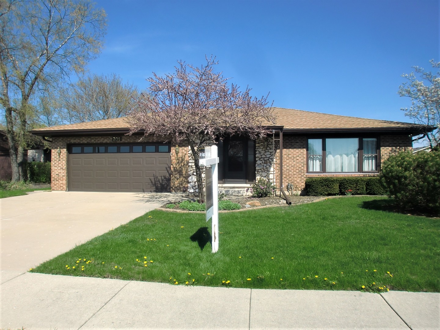 701 Ridge Court Schaumburg, IL 60193 - Photo 24 of 24 a front view of a house with a yard garage and outdoor seating