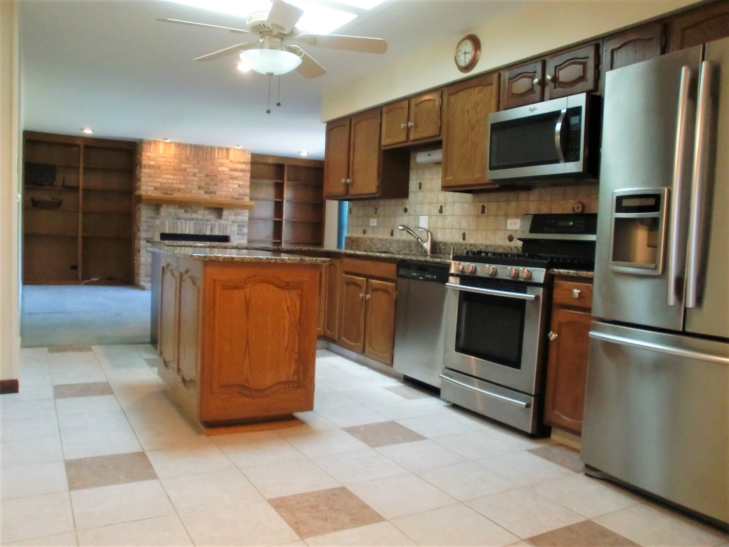 701 Ridge Court Schaumburg, IL 60193 - Photo 6 of 24 a kitchen with stainless steel appliances granite countertop a stove top oven a sink and dishwasher