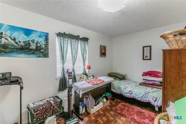 a bedroom with baby toys and a dresser