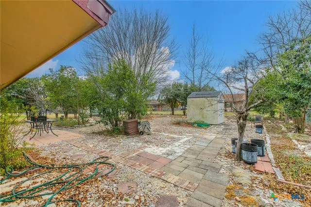 a house view with a garden space