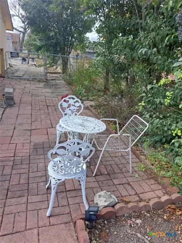 a view of a brick house with a yard