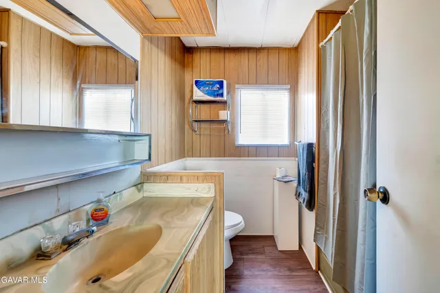 a view of a bathroom with a sink and a window