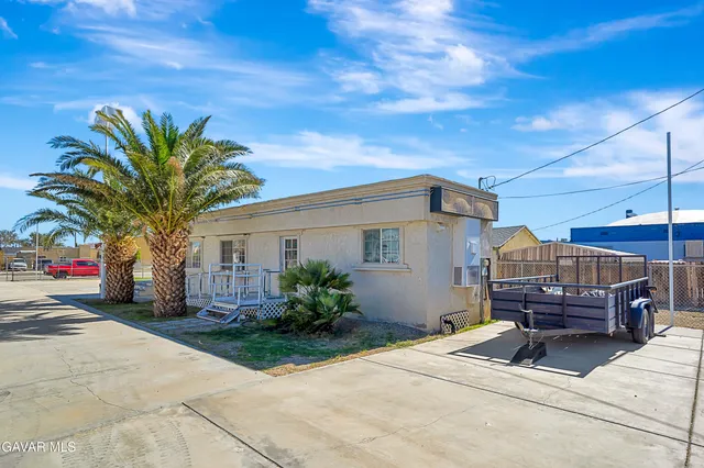 a house view with a garden space