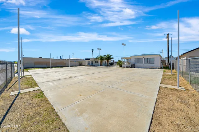 a view of a swimming pool with a yard