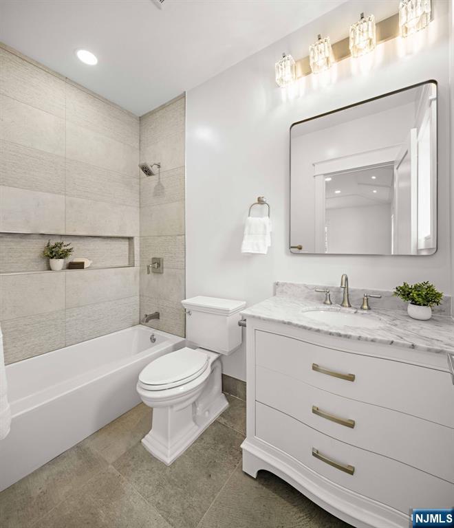14 Beechwood Road Ho-Ho-Kus, NJ 07423 - Photo 14 of 31 a bathroom with a granite countertop toilet a sink and a mirror