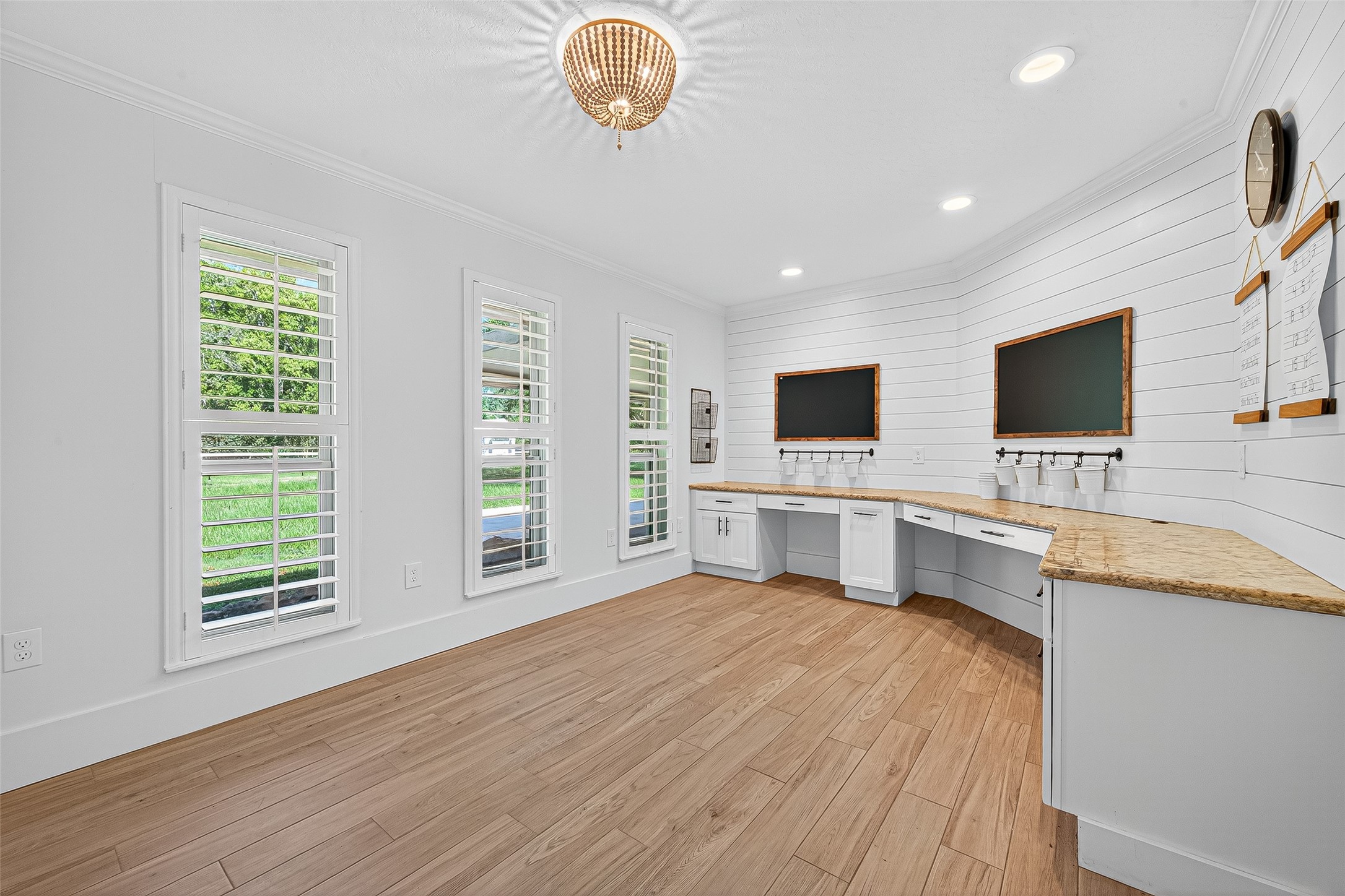 3115 Eula Morgan Road Katy, TX 77493 - Photo 25 of 36 a view of a kitchen with stainless steel appliances wooden floor and chandelier