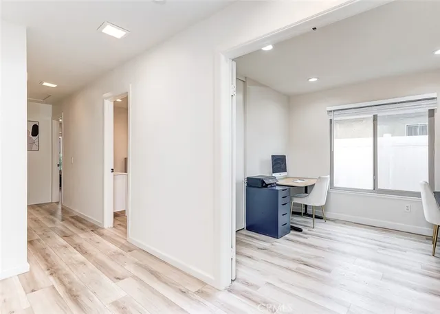 a workspace with furniture and wooden floor