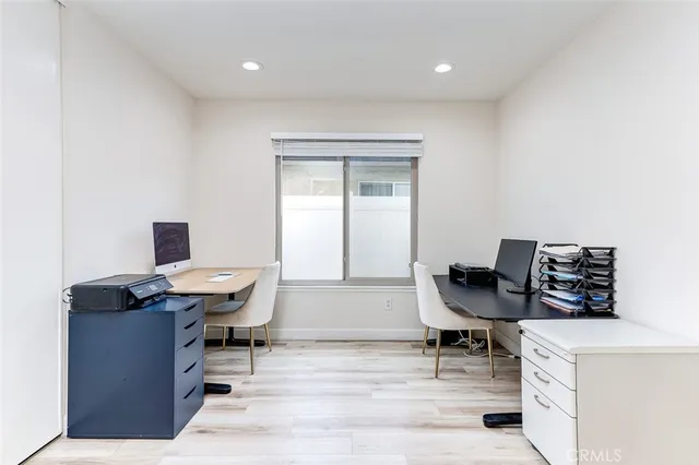 a bedroom with a bed and a table in it