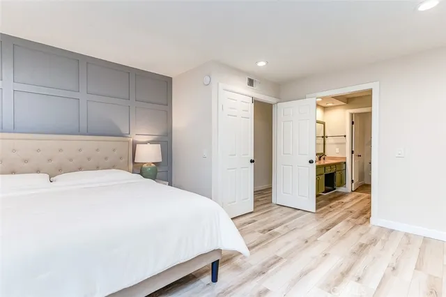 a bedroom with a bed and a fireplace