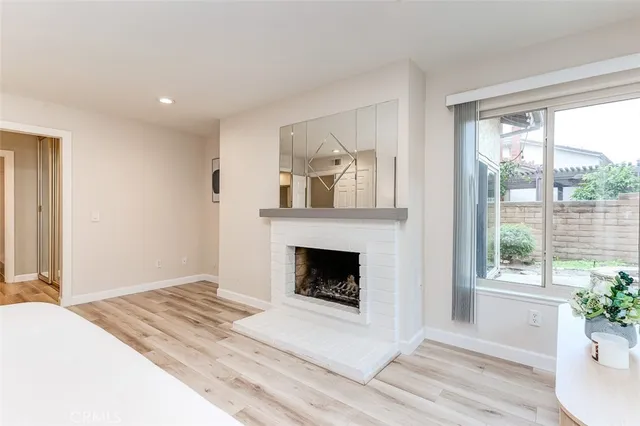 a bathroom with a double vanity sink toilet and a tub