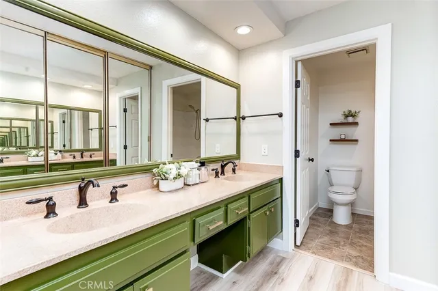 a white toilet sitting next to a bath tub