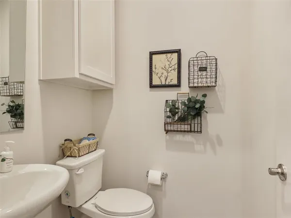 a bathroom with a toilet sink and shower