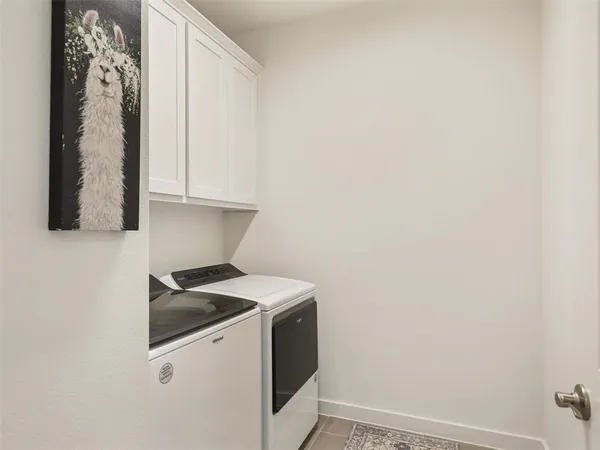 a view of a hallway with closet and bathroom