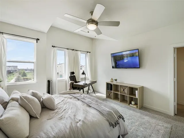 a bedroom with a bed and a table in it