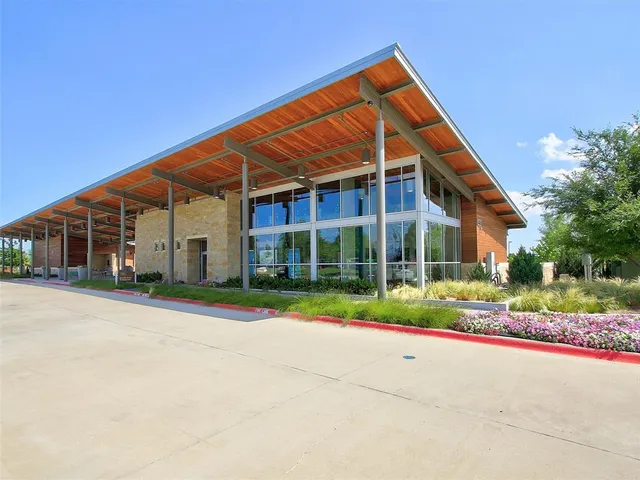 a view of pool with a yard