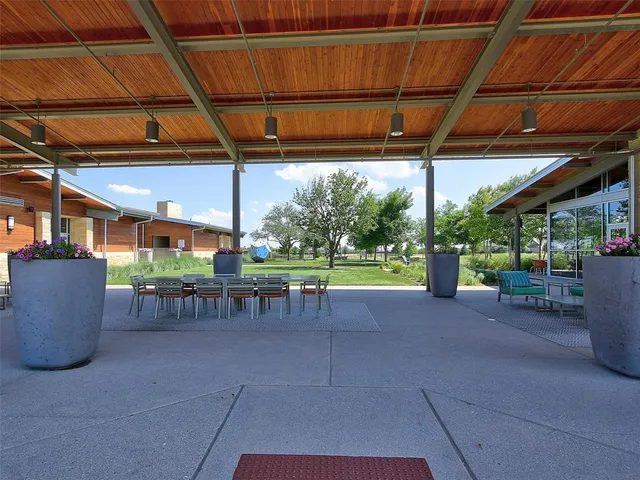 a view of a park with trees and grass
