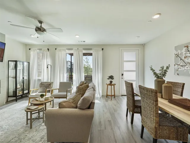 a view of swimming pool with outdoor seating and plants