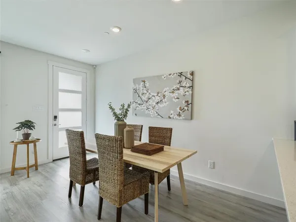 a living room with furniture wooden floor and a fireplace