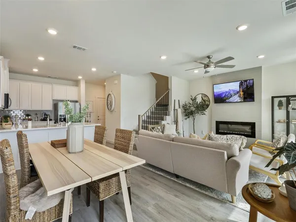 a view of a dining room with furniture and wooden floor