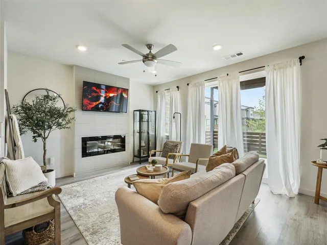 a living room with furniture and a fireplace