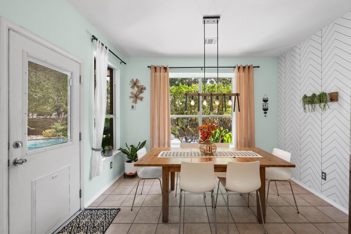 12201 Barrel Bend Austin, TX 78748 - Photo 11 of 35 Dining room featuring tile patterned floors and an accent wall