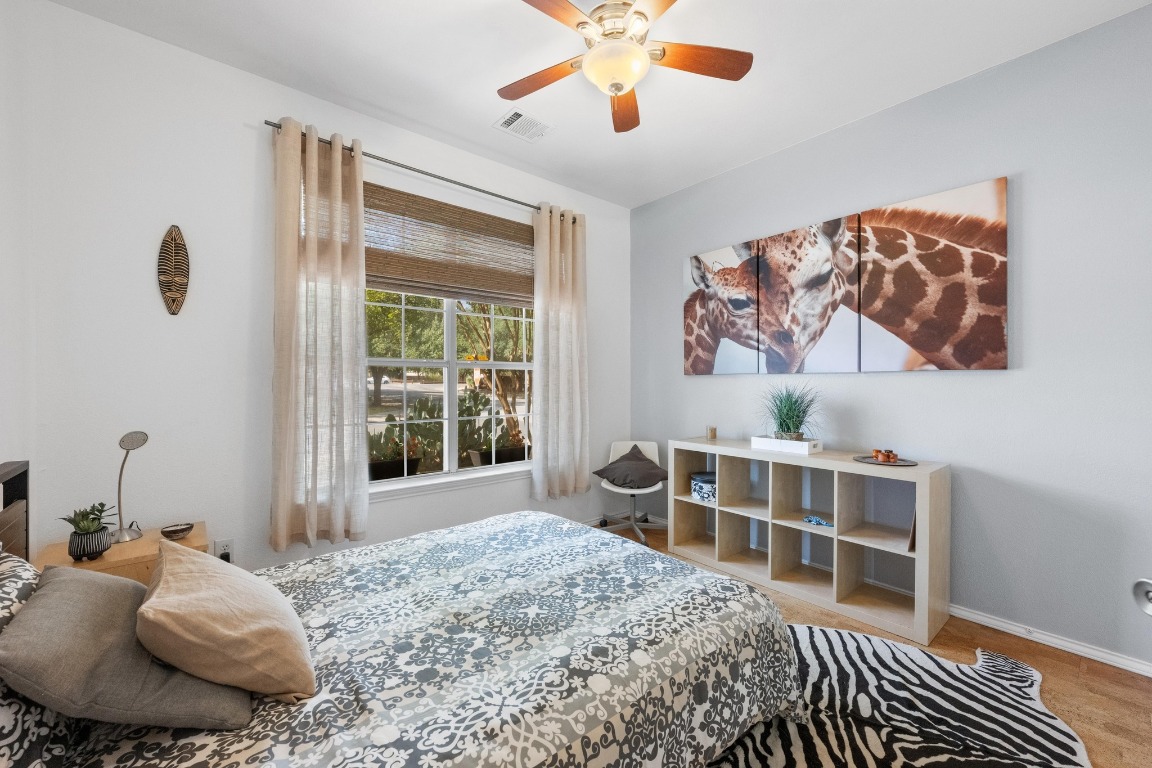12201 Barrel Bend Austin, TX 78748 - Photo 26 of 35 Bedroom featuring a ceiling fan and baseboards