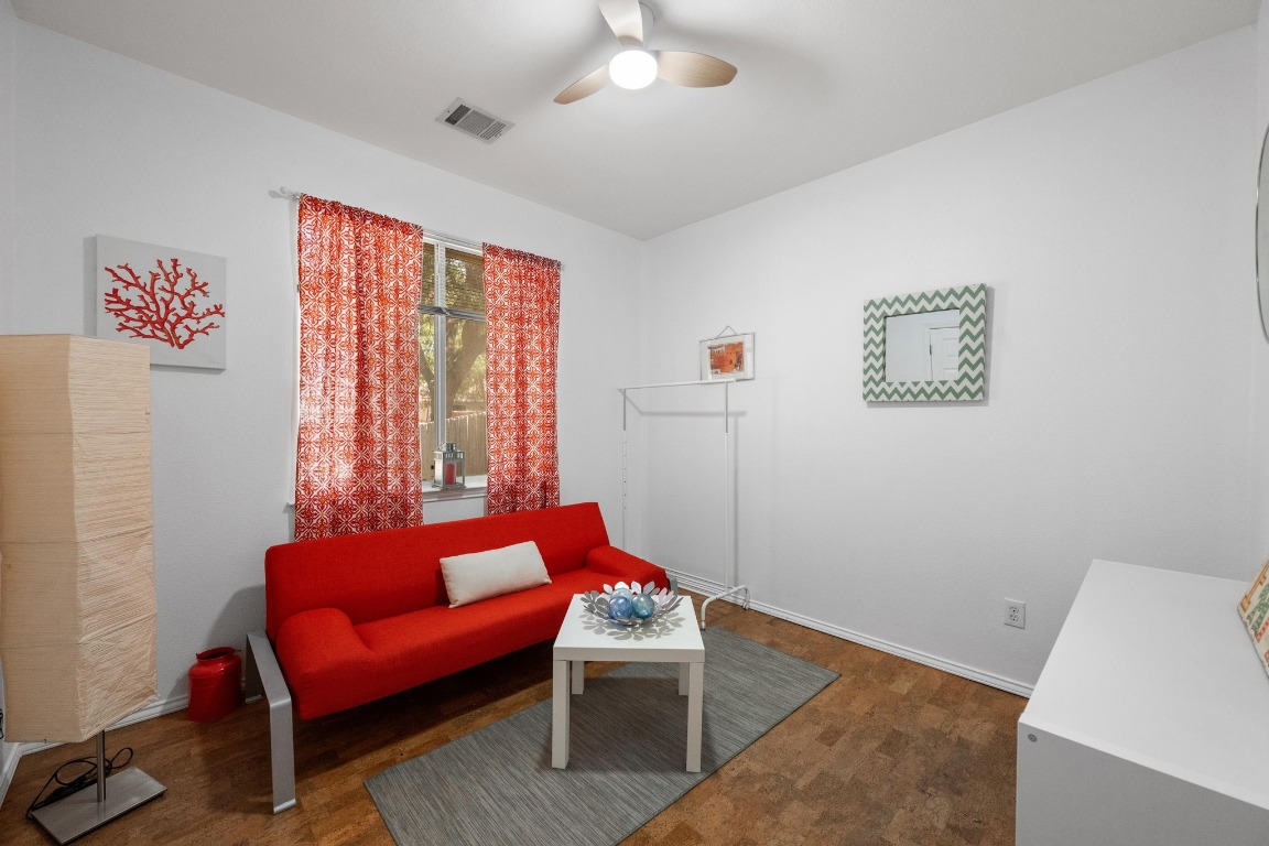 12201 Barrel Bend Austin, TX 78748 - Photo 28 of 35 Living area featuring wood finished floors and ceiling fan