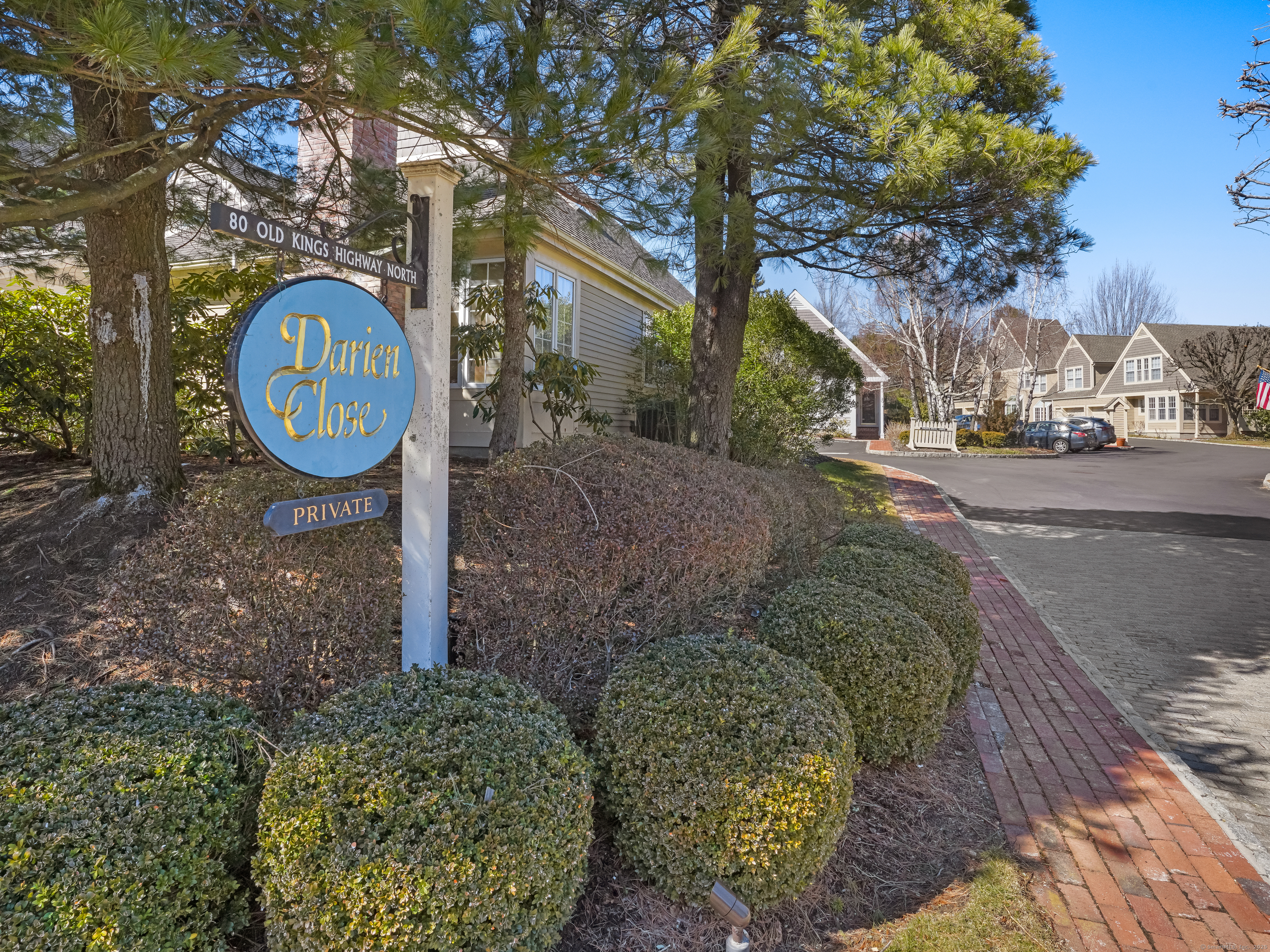 7 Darien Cl, Unit 7 Darien, CT 06820 - Photo 1 of 1 a front view of a house with garden