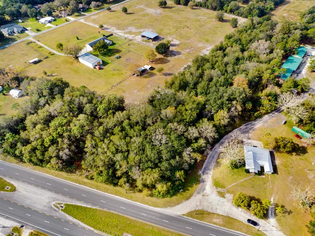 an aerial view of swimming pool a yard and swimming pool