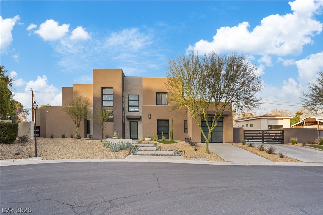 3740 Caesars Circle Las Vegas, NV 89120 - Photo 2 of 89 This desert contemporary home presents an elegant facade with minimalist landscaping.